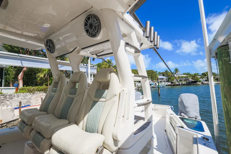 Slide: The Image of 2021 Solace 345 boat interior with luxury seating and waterfront view. - 8