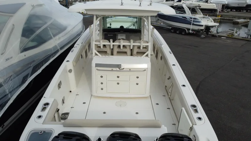 Slide: The Image of 2017 Boston Whaler 350 Outrage boat, spacious deck, docked at marina. - 10