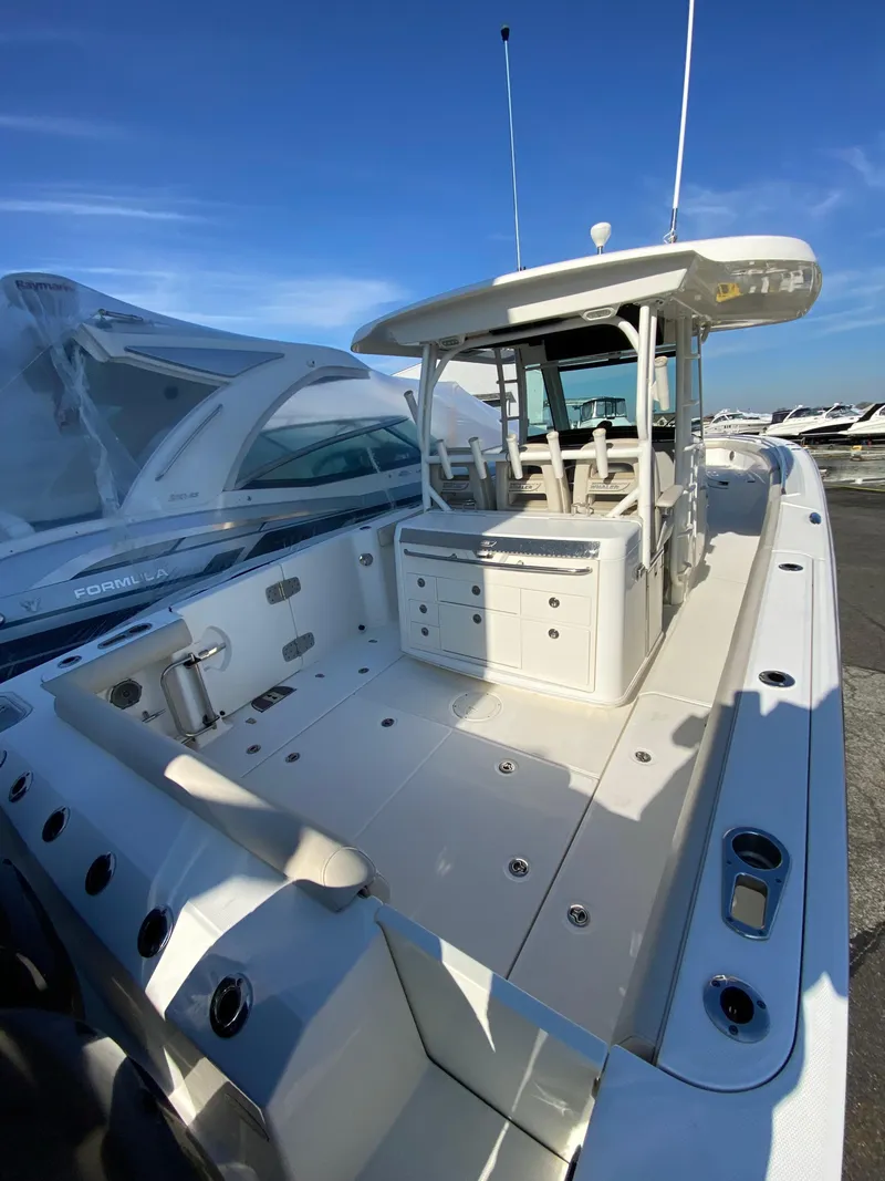 Slide: The Image of 2017 Boston Whaler 350 Outrage boat with spacious deck and modern design. - 12