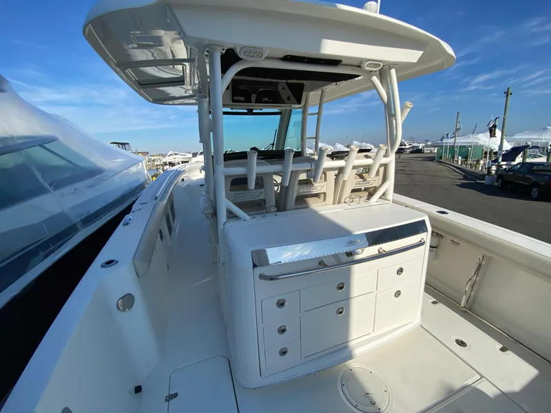 Slide: The Image of 2017 Boston Whaler 350 Outrage boat deck with seating and storage compartments. - 15