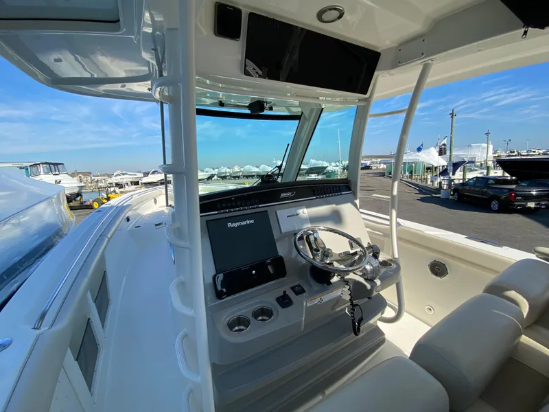 Slide: The Image of 2017 Boston Whaler 350 Outrage helm with modern controls and navigation system. - 17