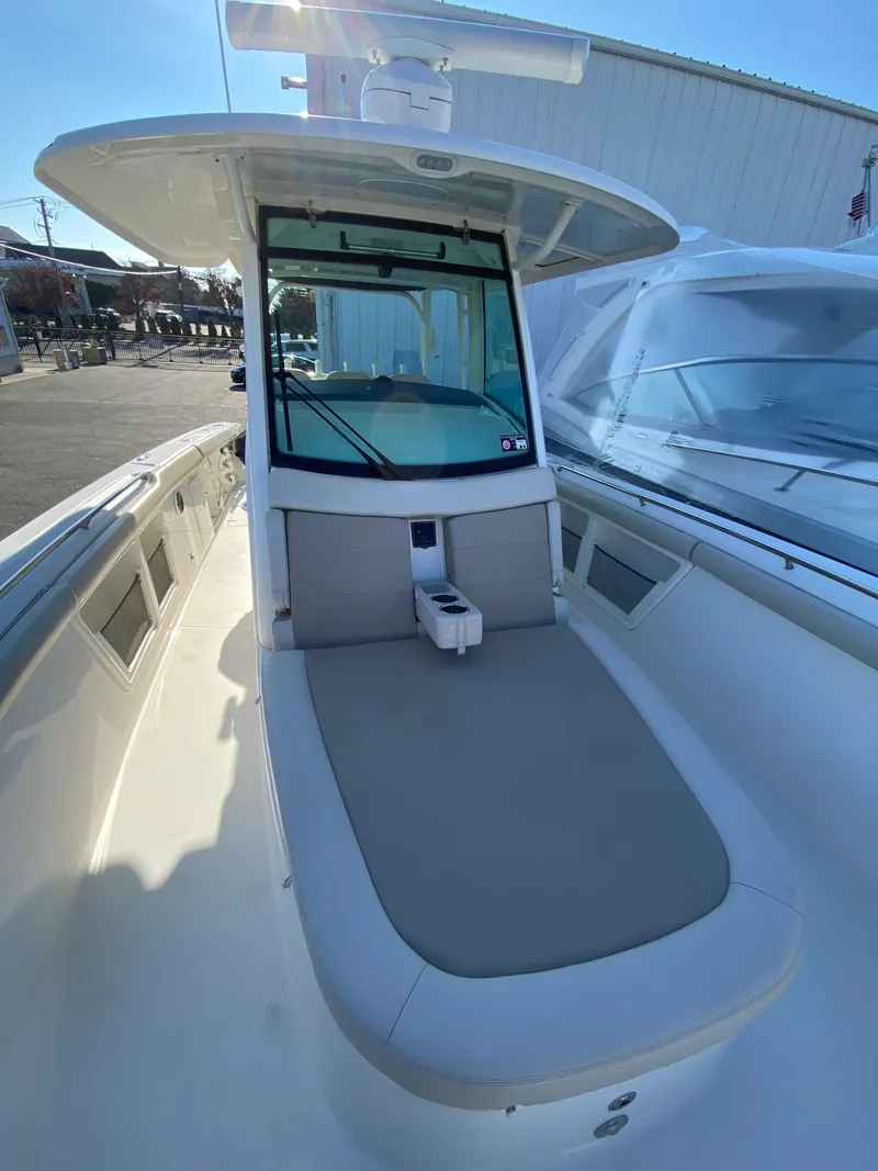 Slide: The Image of 2017 Boston Whaler 350 Outrage boat with spacious deck and seating area. - 24