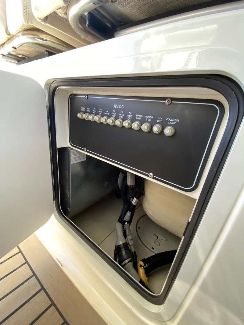 Slide: The Image of 2017 Boston Whaler 350 Outrage electrical panel with open access door. - 30