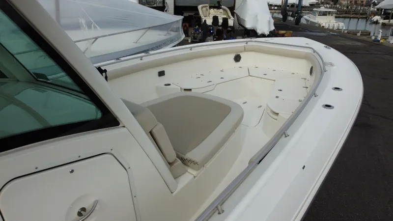 Slide: The Image of 2017 Boston Whaler 350 Outrage boat interior with seating and storage. - 5