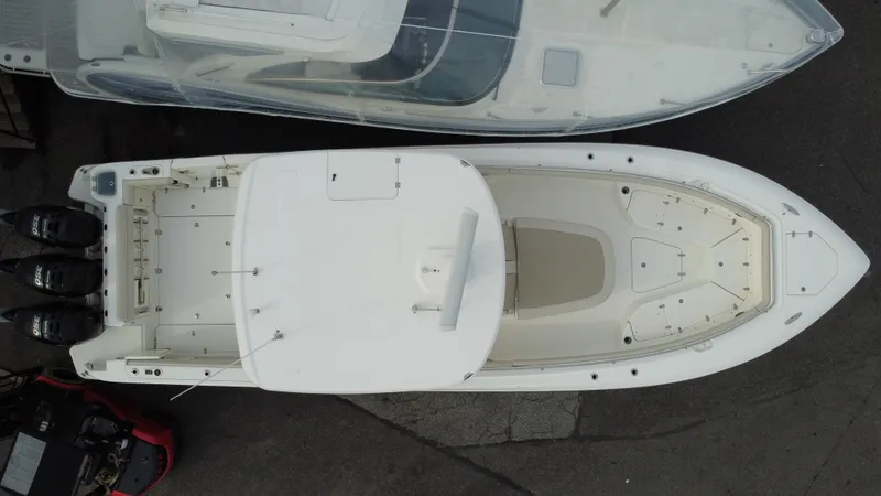 Slide: The Image of Aerial view of 2017 Boston Whaler 350 Outrage boat docked beside another vessel. - 9