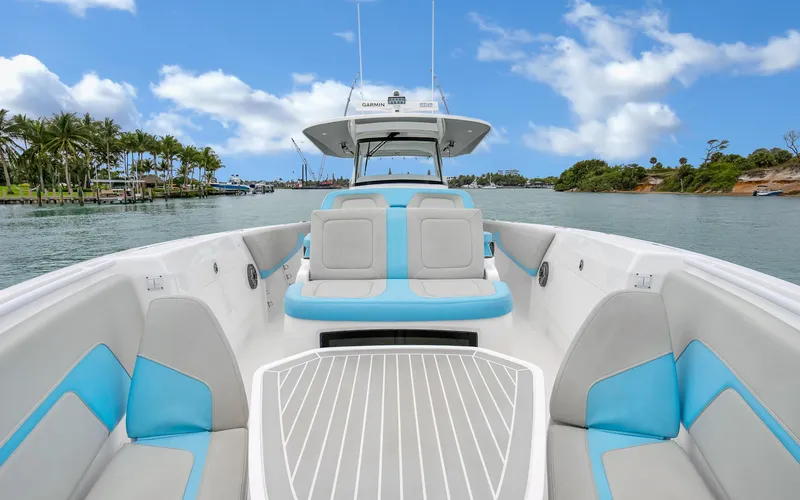 Slide: The Image of 2020 Intrepid 407 Panacea boat with blue and gray seating on a sunny day. - 10