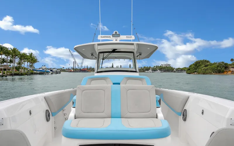 Slide: The Image of 2020 Intrepid 407 Panacea boat on calm water, featuring spacious seating and modern design. - 11