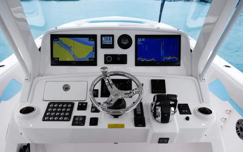 Slide: The Image of 2020 Intrepid 407 Panacea helm with navigation screens and controls. - 14