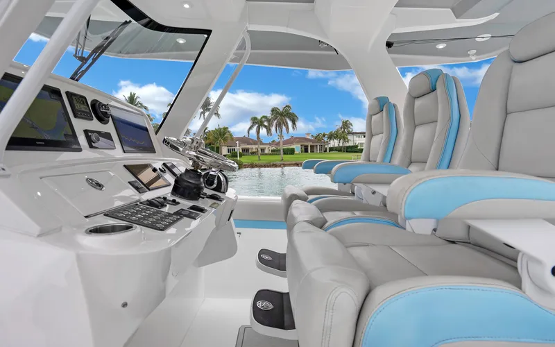 Slide: The Image of Interior of 2020 Intrepid 407 Panacea boat with luxurious seating and advanced controls. - 15