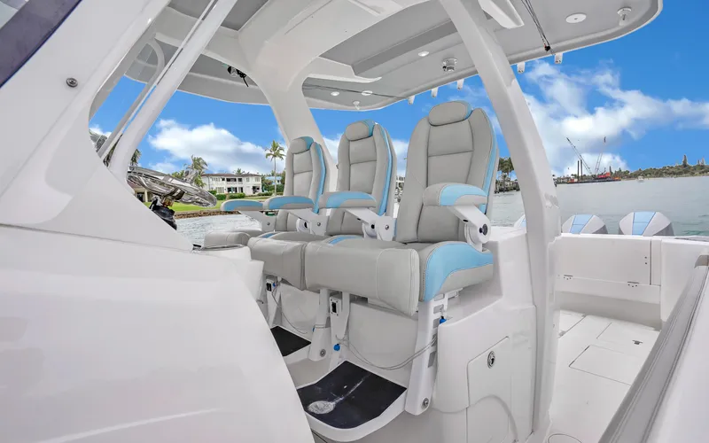 Slide: The Image of 2020 Intrepid 407 Panacea boat interior with luxurious seating and ocean view. - 16