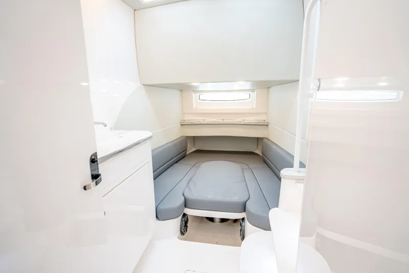 Slide: The Image of 2020 Intrepid 407 Panacea cabin interior with modern white and gray design. - 18