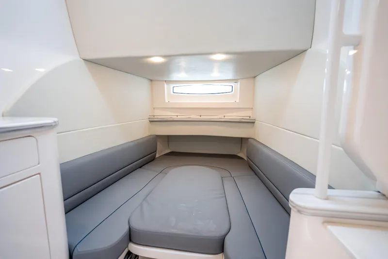Slide: The Image of 2020 Intrepid 407 Panacea cabin interior with gray seating and window. - 19