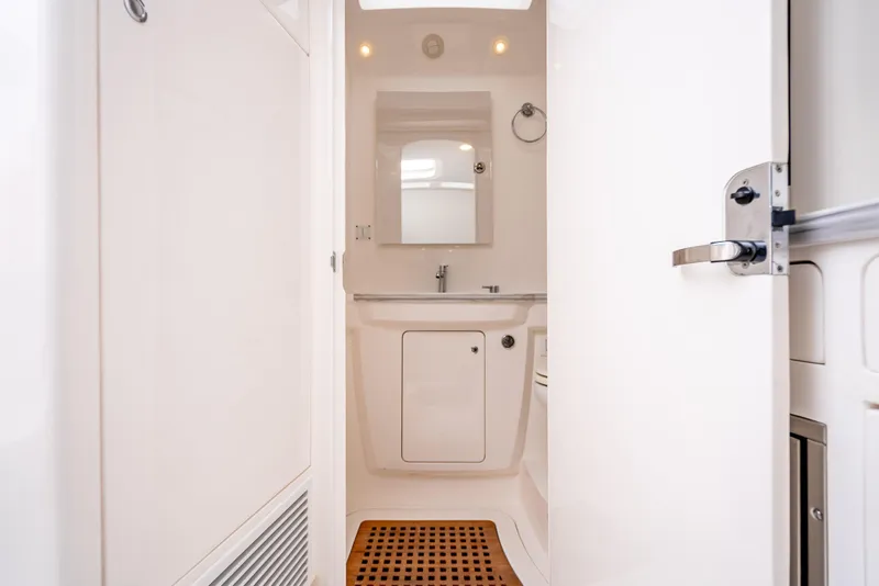 Slide: The Image of 2020 Intrepid 407 Panacea bathroom interior with modern fixtures and wooden floor mat. - 21