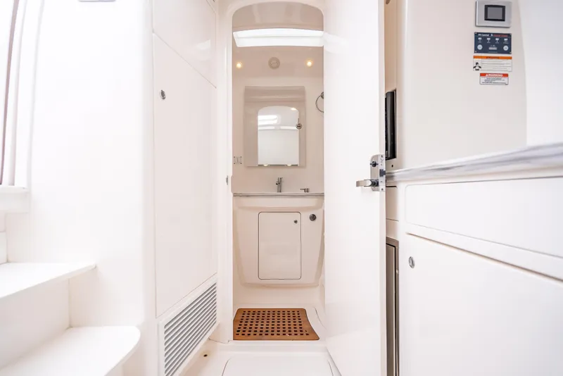 Slide: The Image of 2020 Intrepid 407 Panacea interior with modern white bathroom and wooden mat. - 22