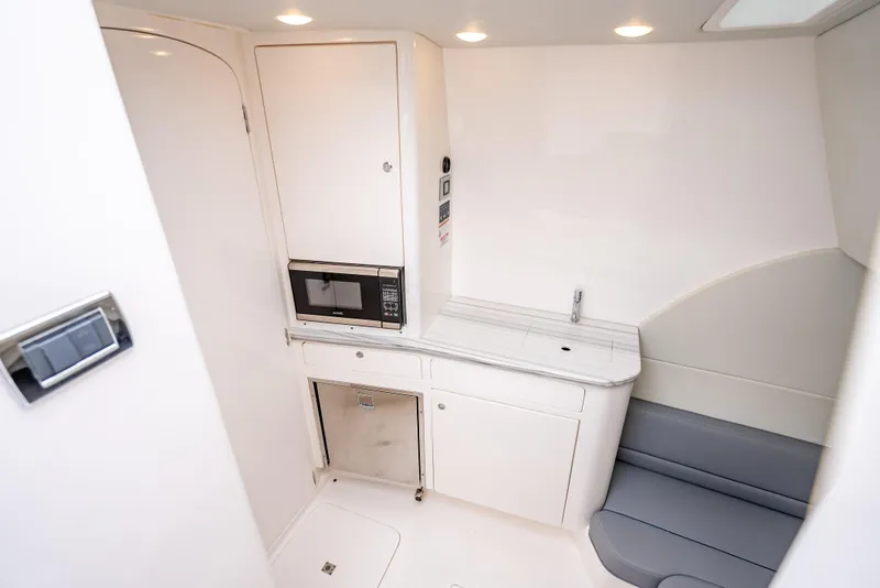 Slide: The Image of 2020 Intrepid 407 Panacea interior with kitchenette and seating area. - 23