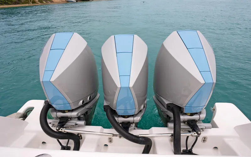 Slide: The Image of Triple outboard engines on a 2020 Intrepid 407 Panacea in turquoise waters. - 34