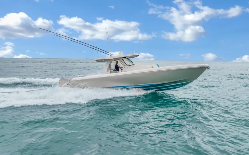 Slide: The Image of 2020 Intrepid 407 Panacea cruising on open water under a clear blue sky. - 35