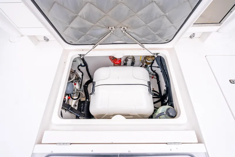 Slide: The Image of Engine compartment of 2020 Intrepid 407 Panacea boat, showcasing internal components. - 36