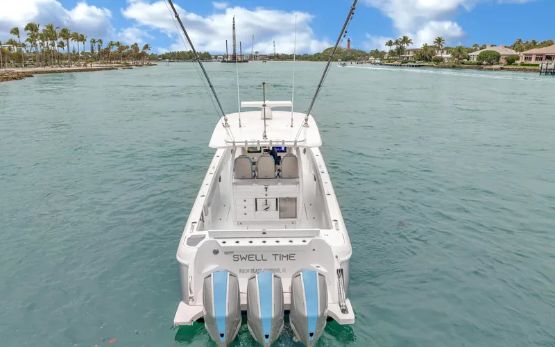 Slide: The Image of 2020 Intrepid 407 Panacea boat with triple engines on a calm waterway. - 38