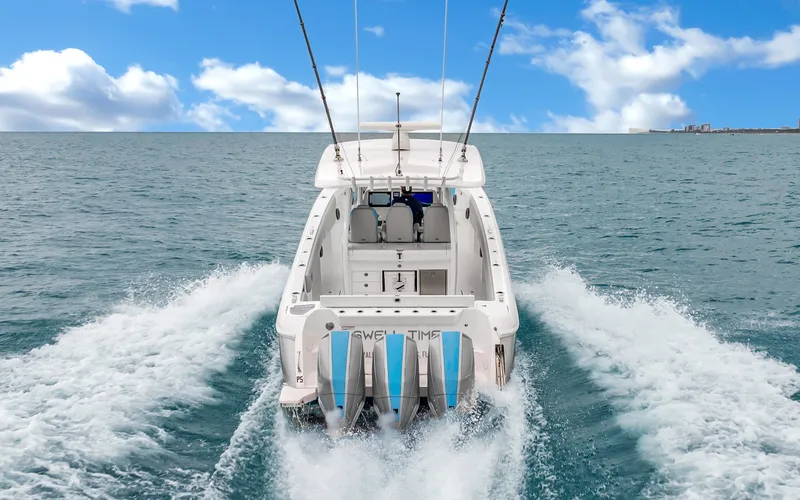 Slide: The Image of Intrepid 407 Panacea 2020 cruising on open water with clear blue sky. - 5