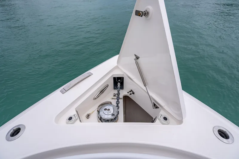 Slide: The Image of Anchor compartment of 2020 Intrepid 407 Panacea boat on calm water. - 6