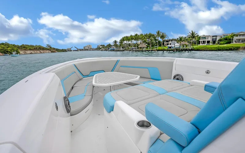 Slide: The Image of 2020 Intrepid 407 Panacea boat with spacious seating, cruising on a scenic waterway. - 8