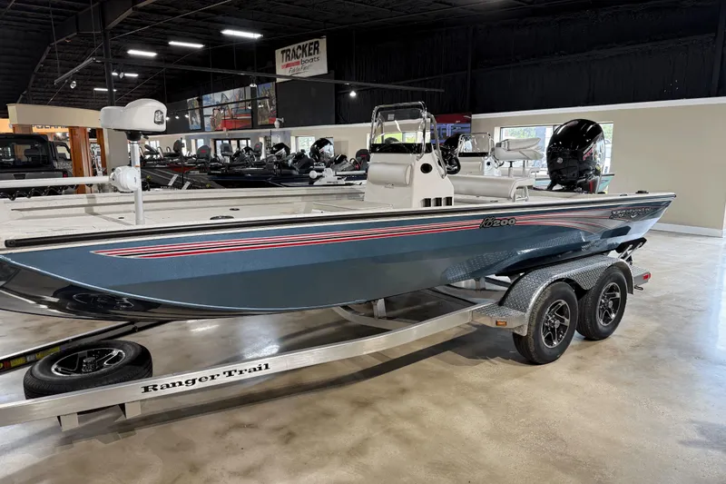 The Image of 2025 Ranger RB200 boat on trailer in showroom, featuring sleek design and modern equipment. - 0