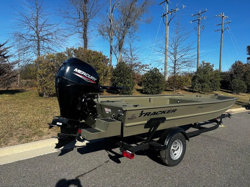 Slide: The Image of 2025 Tracker Grizzly 1654 T Sportsman boat with Mercury engine on trailer. - 3