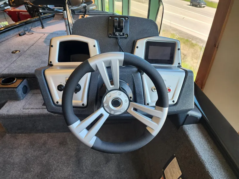 Slide: The Image of Steering console of 2025 Tracker Pro Team 175 boat with dual displays. - 2