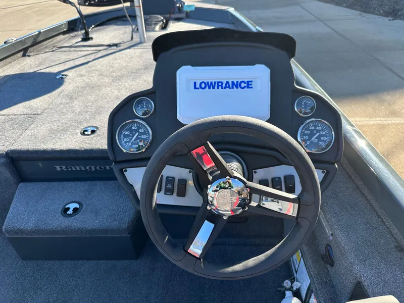 Slide: The Image of 2025 Ranger RT188P boat dashboard with Lowrance display and steering wheel. - 5