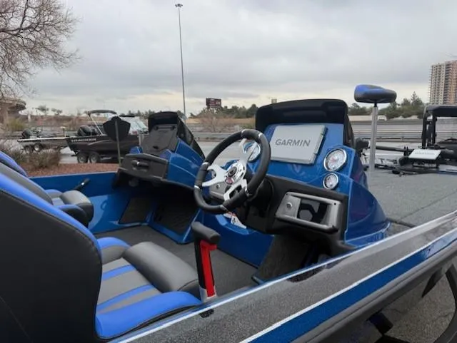Slide: The Image of 2025 Nitro Z20 XL Pro boat interior with Garmin navigation system, blue and gray seating. - 5