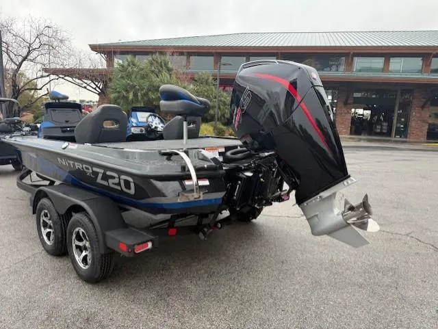 Slide: The Image of 2025 Nitro Z20 XL Pro boat with powerful outboard motor, parked outdoors. - 6