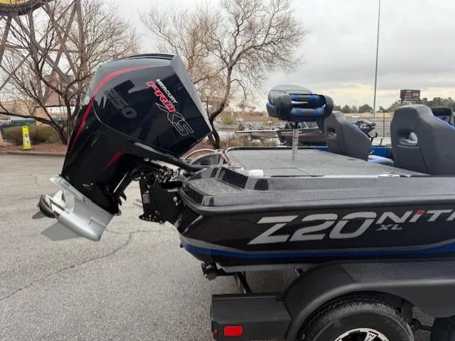 Slide: The Image of 2025 Nitro Z20 XL Pro boat with powerful outboard motor, parked on a paved surface. - 7