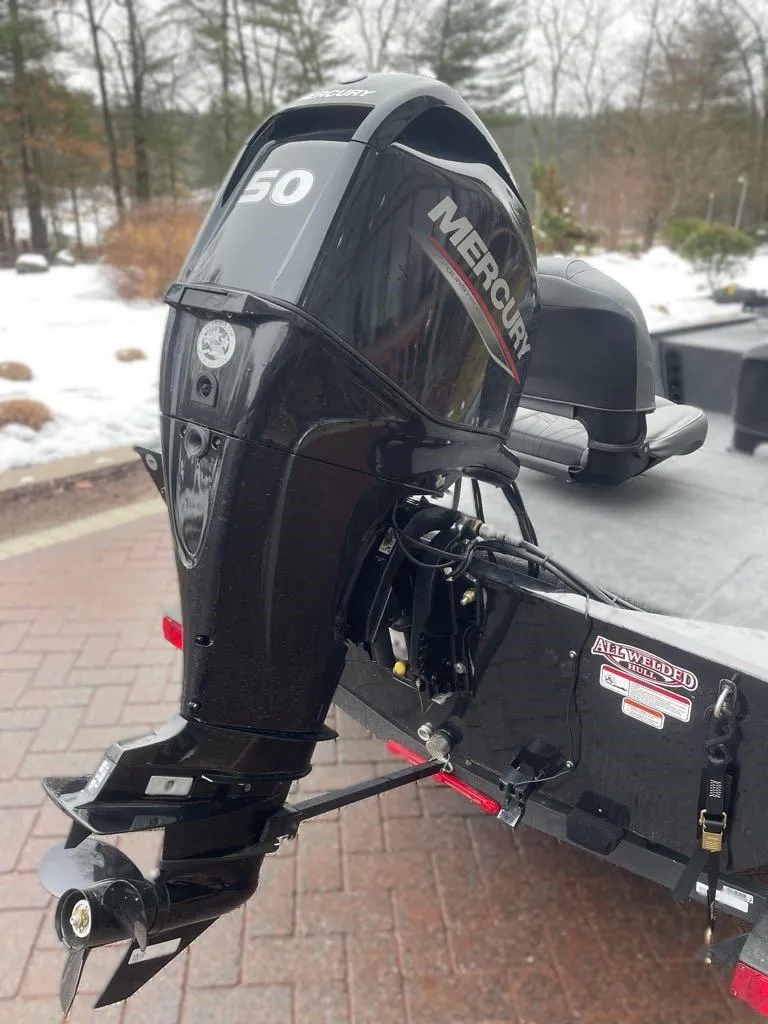 Slide: The Image of 2025 Tracker Bass Tracker Classic XL with Mercury 50 outboard motor in snowy setting. - 4