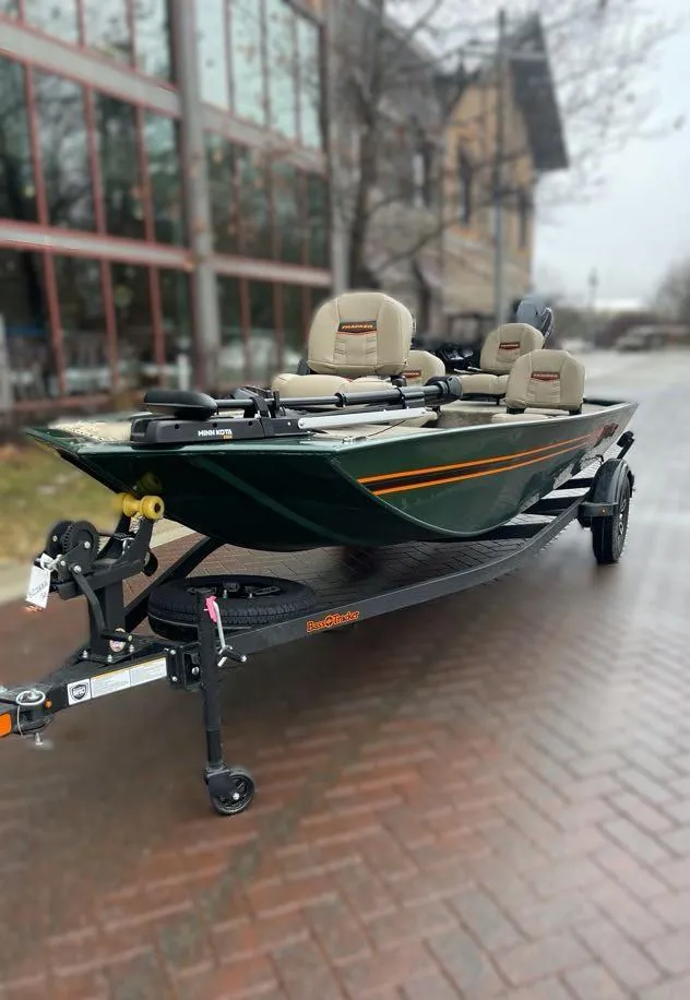 Slide: The Image of 2025 Tracker Bass Tracker Classic Limited boat on trailer, parked outdoors. - 5