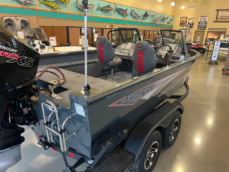 Slide: The Image of 2025 Ranger VS1882SC Reata boat displayed in showroom, featuring dual seats and Mercury Pro XS engine. - 1