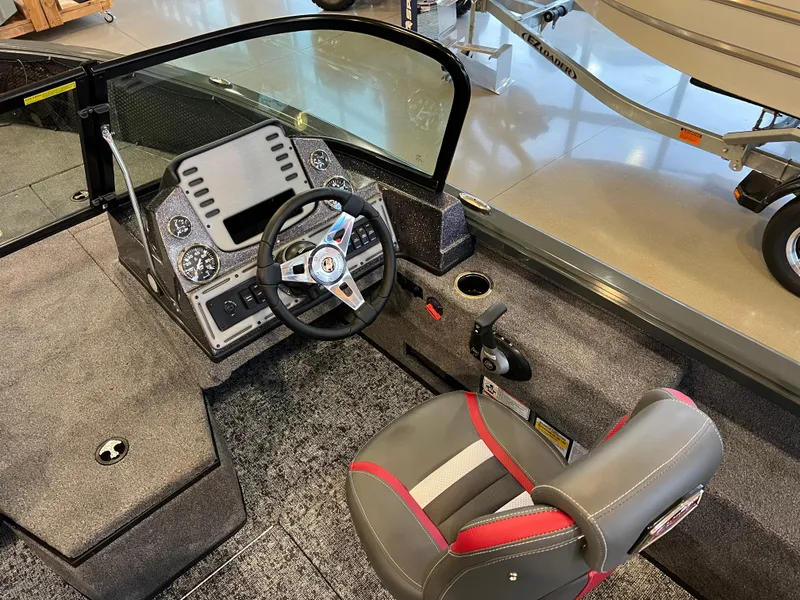 Slide: The Image of 2025 Ranger VS1882SC Reata boat interior with steering console and seating. - 4