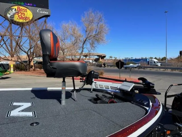 Slide: The Image of 2025 Nitro Z18 Pro boat with fishing seat, parked near Bass Pro Shops. - 11