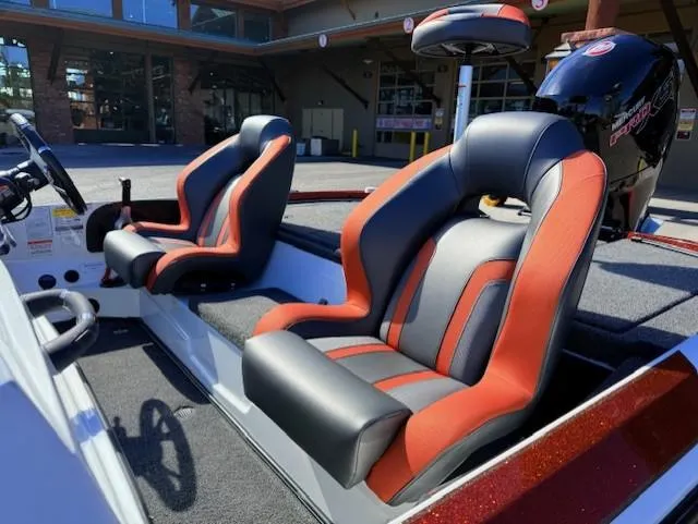 Slide: The Image of 2025 Nitro Z18 Pro boat interior with red and black seats, steering wheel visible. - 7