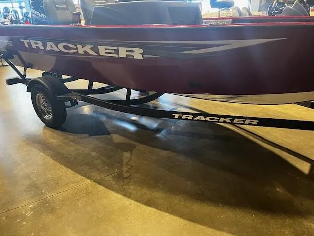 Slide: The Image of 2025 Tracker Pro Guide V-16 SC boat on trailer, showroom display. - 2