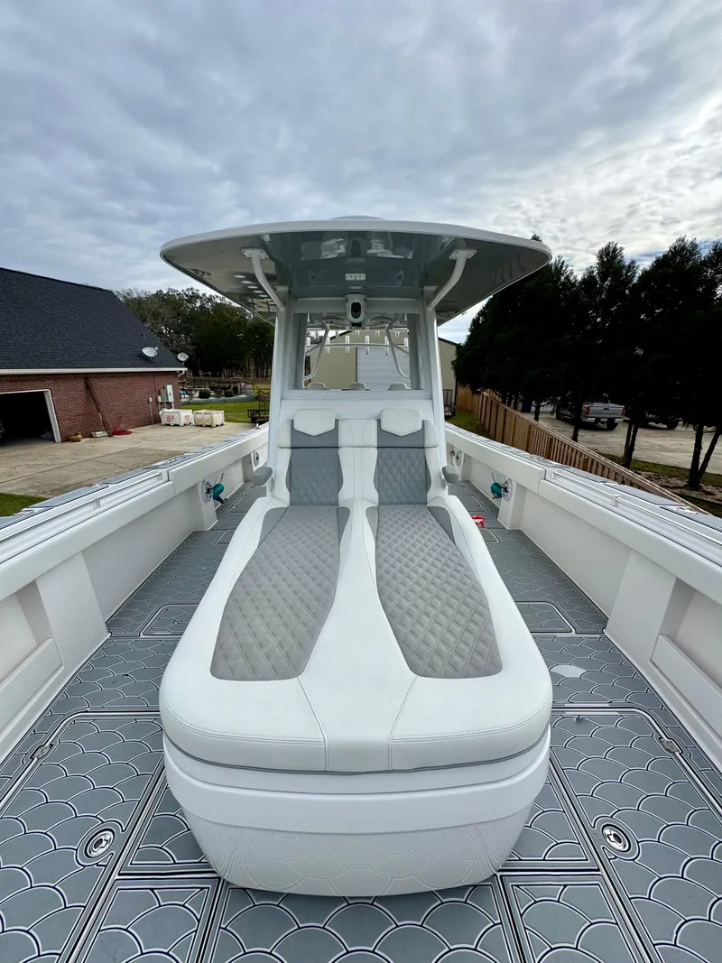 Slide: The Image of 2022 Invincible 35 Catamaran with sleek deck design and comfortable seating. - 11