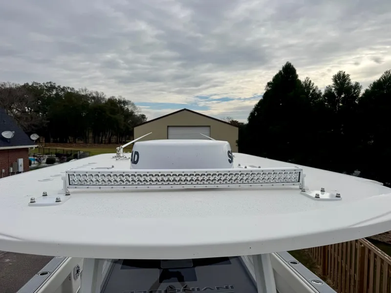 Slide: The Image of Invincible 35 Catamaran 2022 roof with LED light bar, overcast sky background. - 15