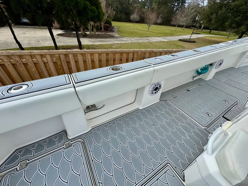 Slide: The Image of 2022 Invincible 35 Catamaran deck with stylish non-slip flooring and storage compartments. - 9