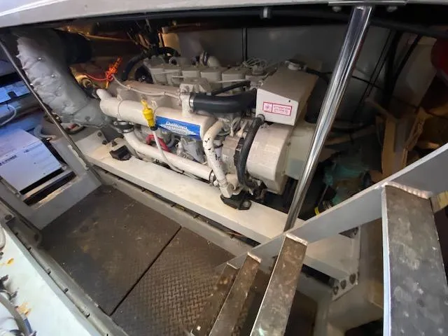 Slide: The Image of Engine room of a 2004 Silverton 39 Motor Yacht, showcasing mechanical components. - 11