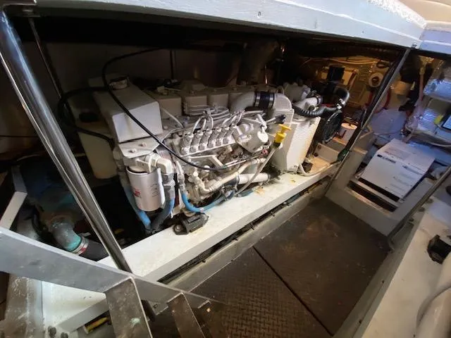 Slide: The Image of Engine room of a 2004 Silverton 39 Motor Yacht, showcasing mechanical components. - 12