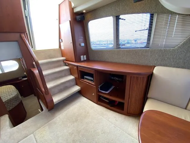 Slide: The Image of Interior of 2004 Silverton 39 Motor Yacht with stairs and seating area. - 4