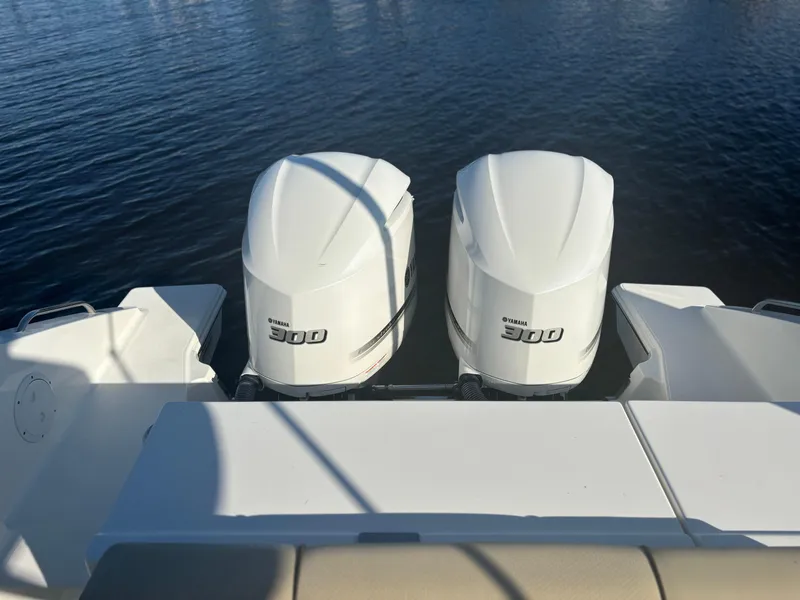 Slide: The Image of 2020 Pursuit DC 295 Dual Console with twin Yamaha 300 engines on water. - 15