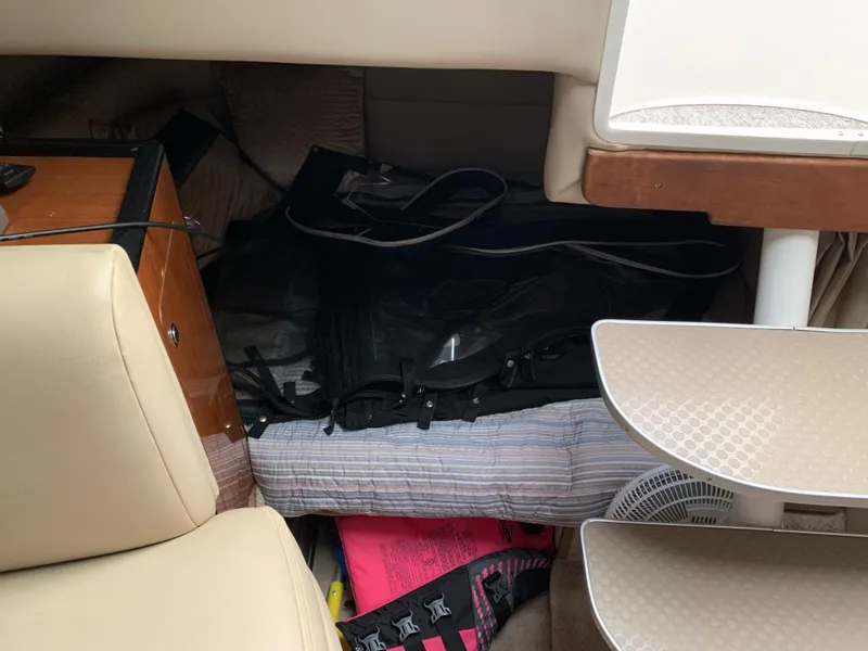 Slide: The Image of Interior cabin of 2000 Chaparral Signature 300 boat with seating and storage. - 10