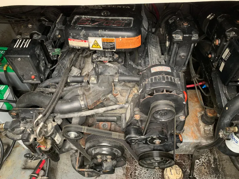 Slide: The Image of Engine of a 2000 Chaparral Signature 300 boat, showcasing mechanical components and belts. - 11