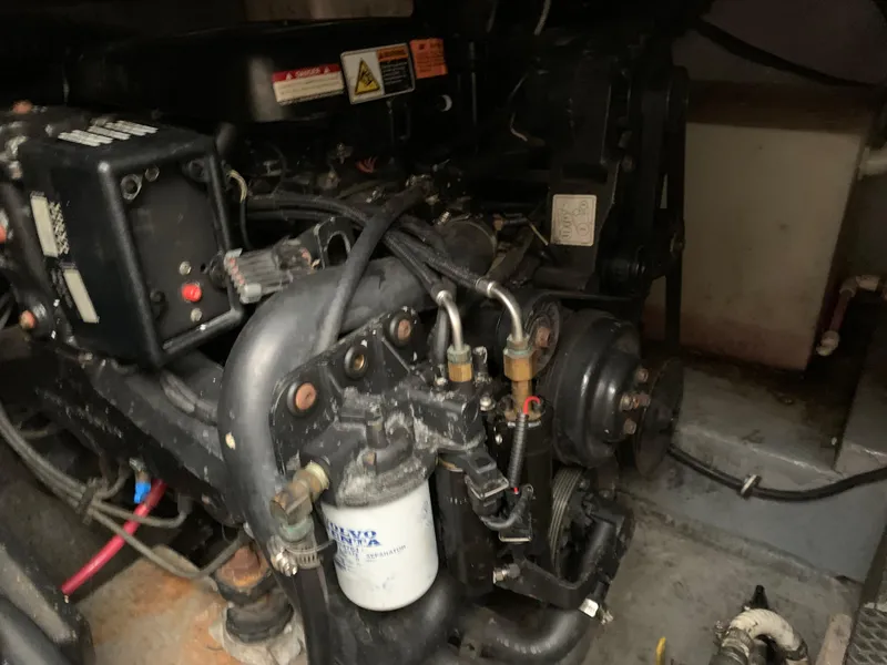 Slide: The Image of Engine compartment of a 2000 Chaparral Signature 300 boat, showcasing mechanical components. - 12